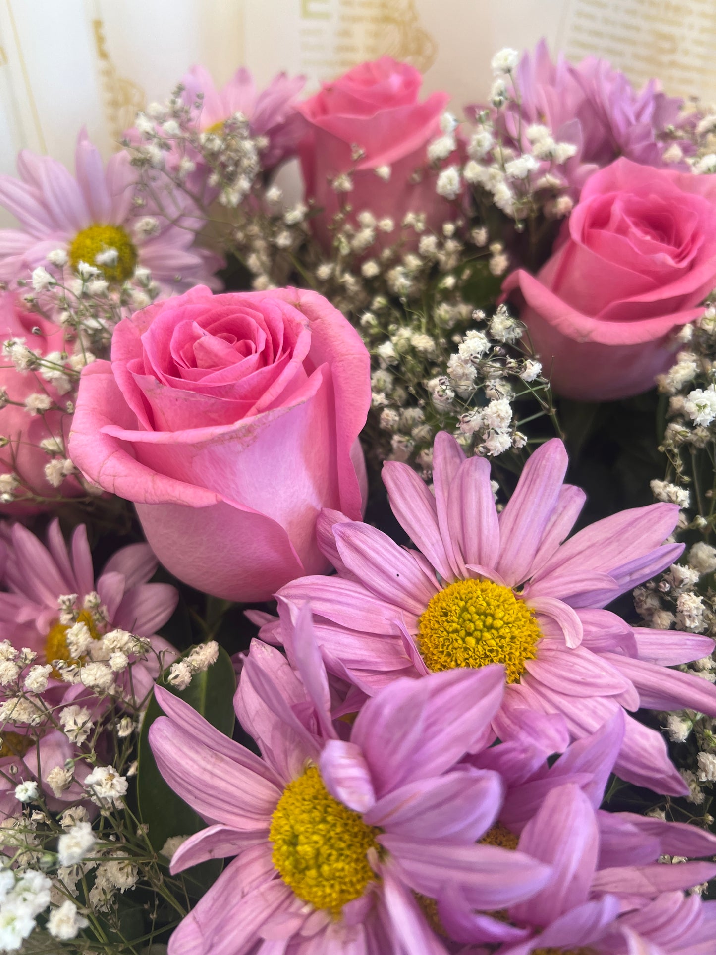 Imported Pink Rose Bouquet with Baby’s Breath – Elegant Newspaper Wrap Design