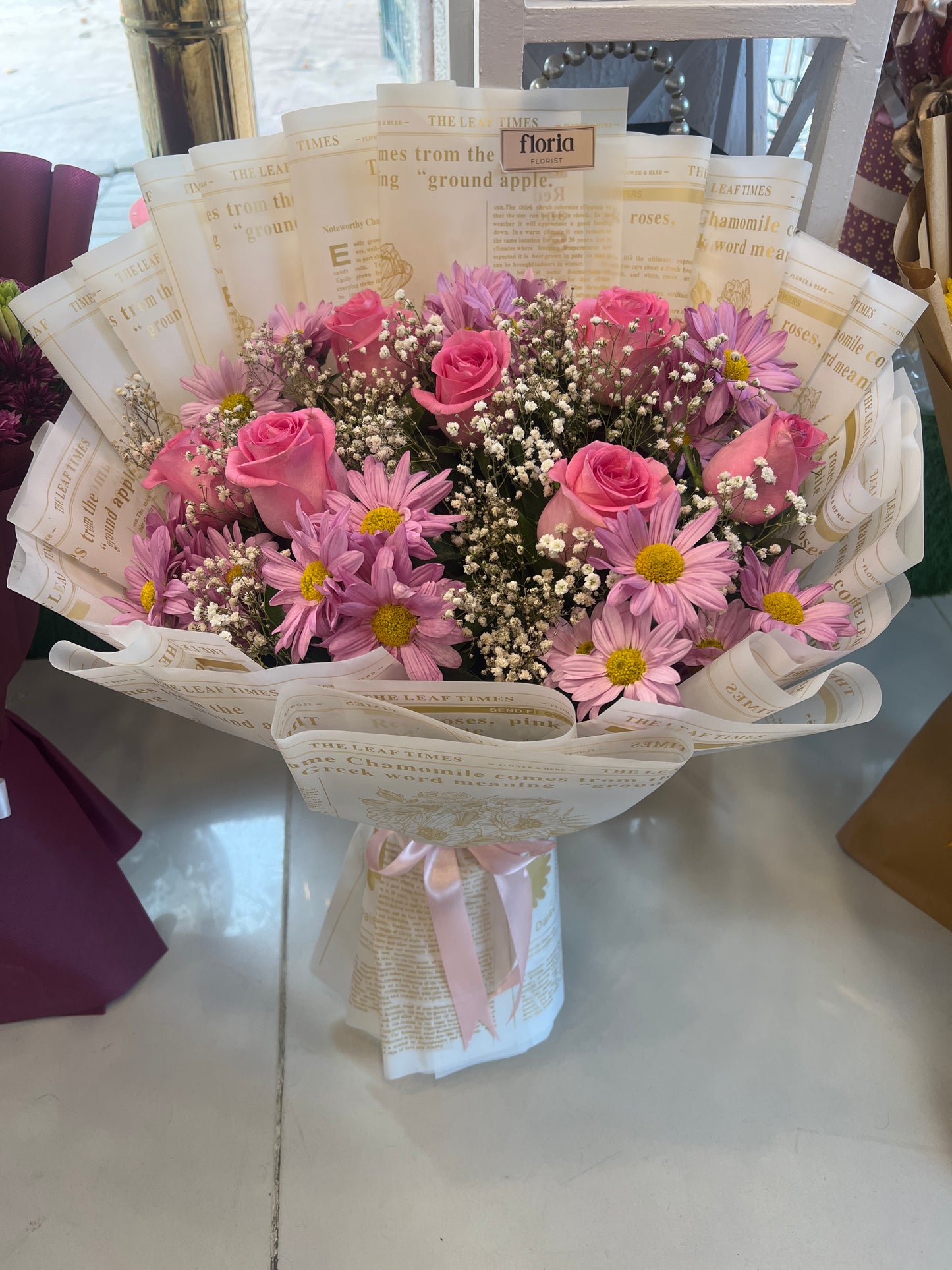 Imported Pink Rose Bouquet with Baby’s Breath – Elegant Newspaper Wrap Design